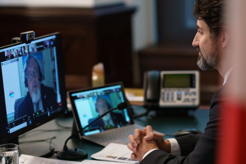 Justin Trudeau at desk with Peter Noteboom on Zoom 